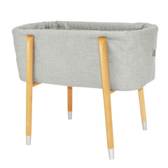 TruBliss Sova Glacier Grey bassinet angled view highlighting deep walls for cozy newborn sleep.