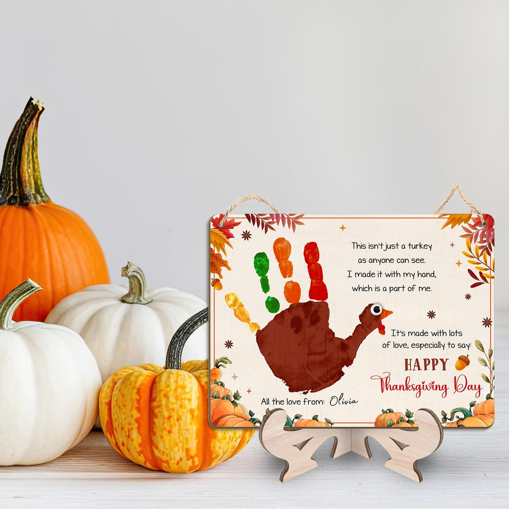 TRUMPETIC turkey handprint sign features a child’s print ready for fall decor.