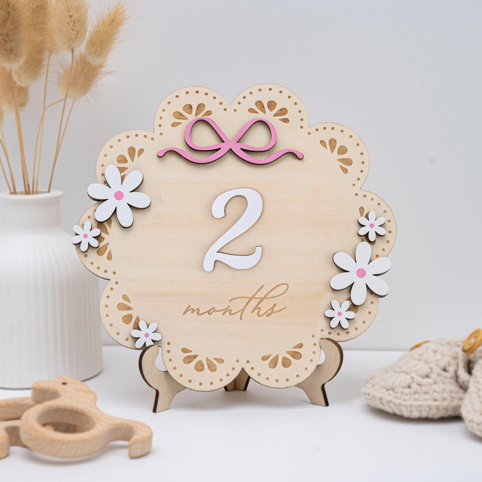 TTMerriwood pink bow accents add charm to baby milestone photos