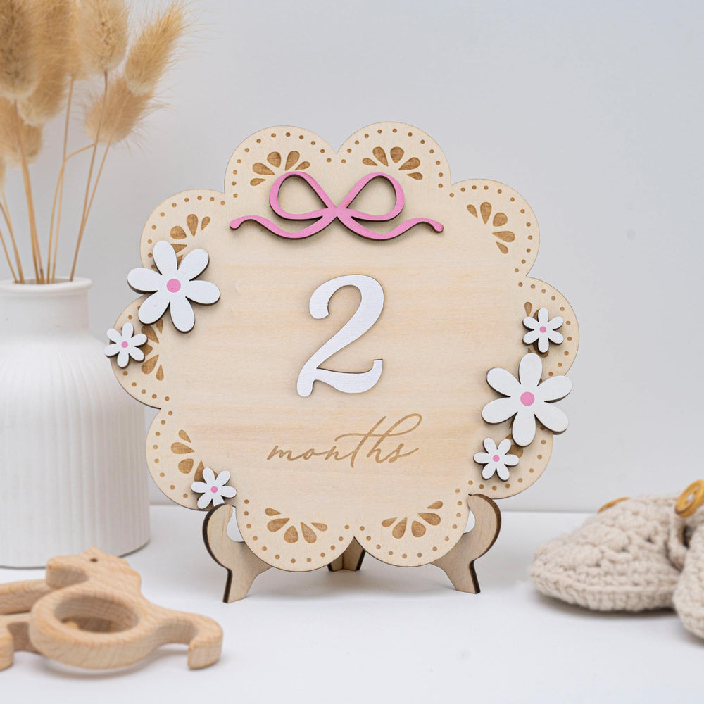 TTMerriwood pink bow accents add charm to baby milestone photos