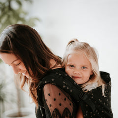 Tula Baby Linen Carrier back view demonstrates comfortable, adjustable fit for longer carry