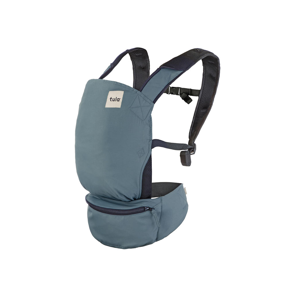Tula Baby Lite front view in slate blue showing compact ergonomic carrier.