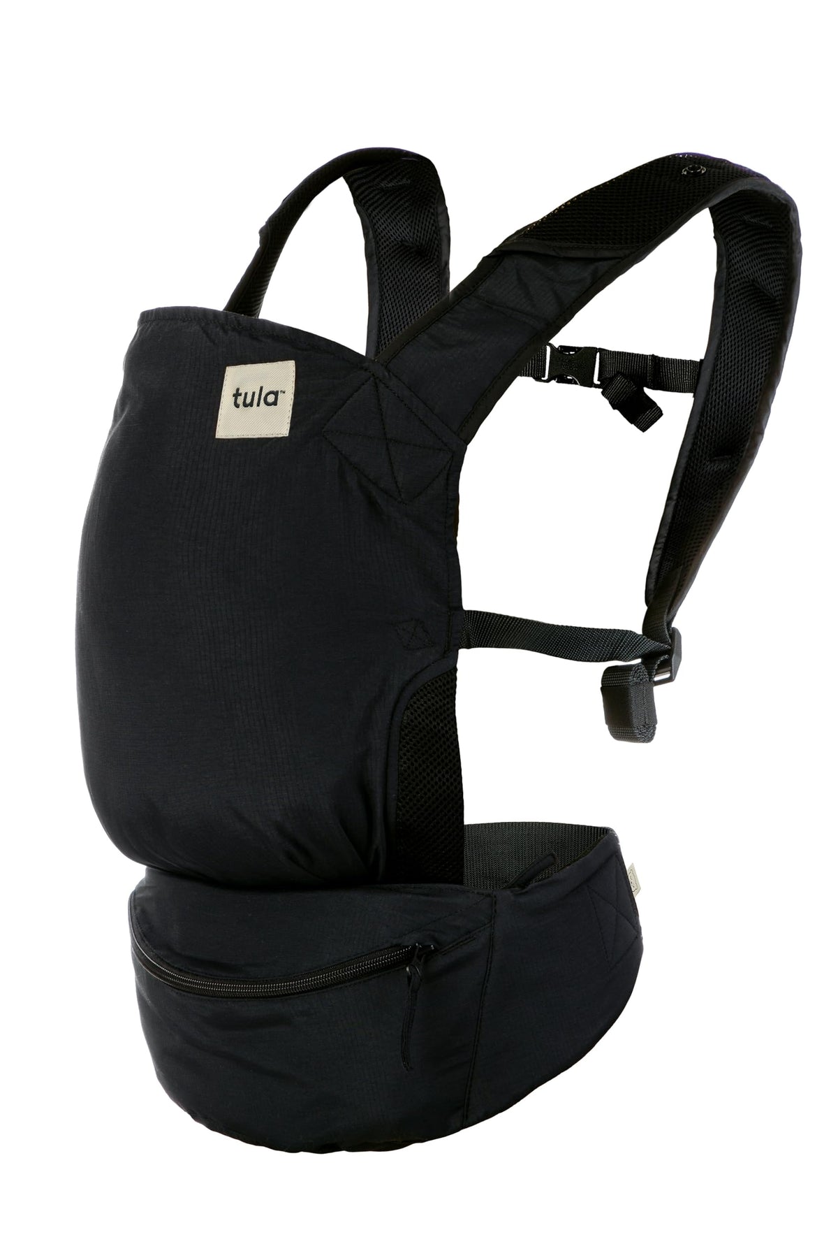 Tula Lite compact carrier packed in waistband for on-the-go storage and quick use.