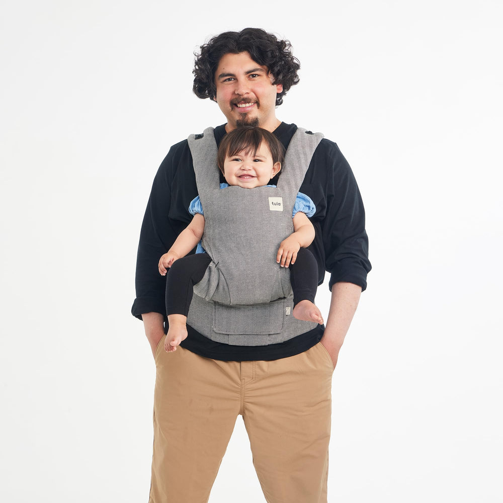 Tula Explore neck pillow and removable hood in ash linen for baby comfort and sun protection.