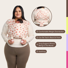 Tula Stretchy Tencel wrap with baby in wrap demonstrates ergonomic hands-free carrying
