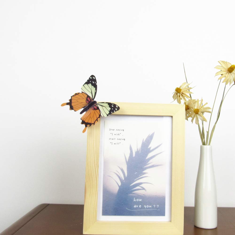 Tuosiwei yellow butterfly wall decal group brightens a bedroom.