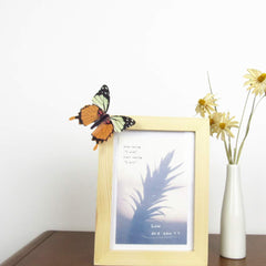 Tuosiwei yellow butterfly wall decal group brightens a bedroom.