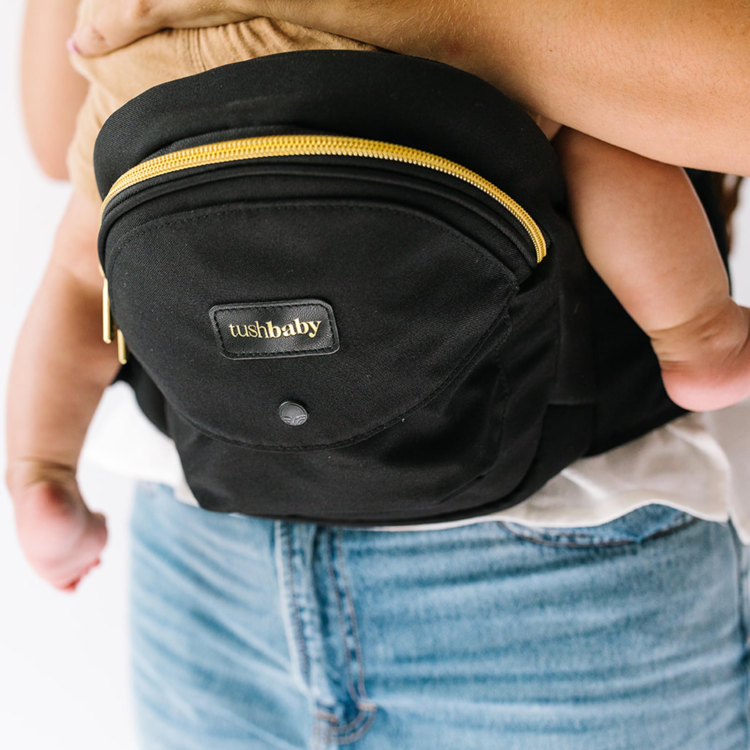 TushBaby bottle-holder closeup highlights discreet feeding support and bottle access.
