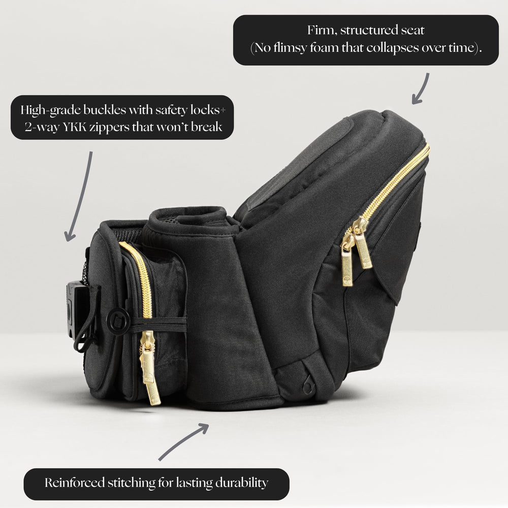 TushBaby hip-seat carrier with baby in carrier demonstrates ergonomic support and weight distribution.