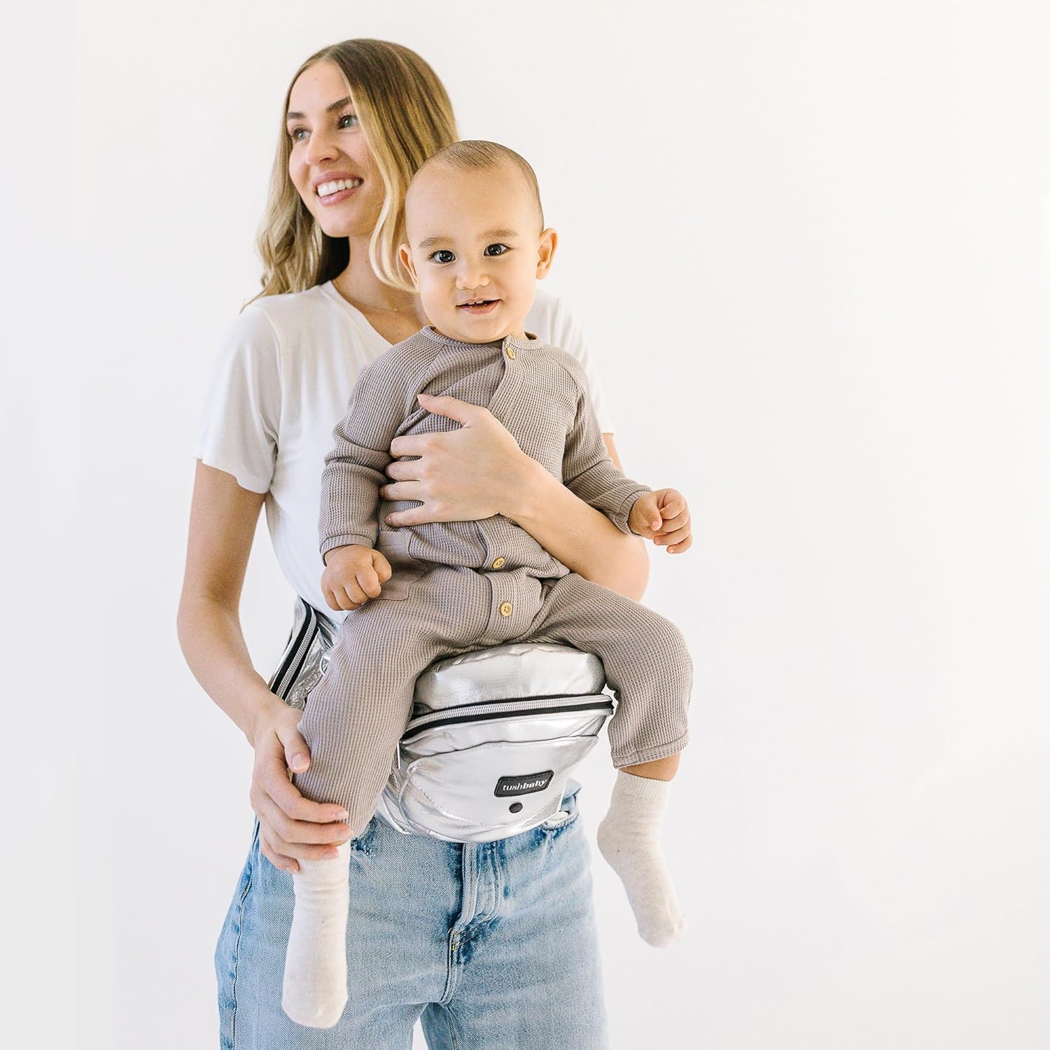 TushBaby hip seat buckle safety closeup shows secure design for on-the-go stability.