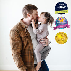 TushBaby Original hip seat in side carry for hands-free tasks.