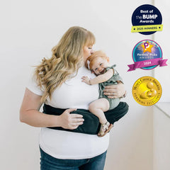 TushBaby side carry provides snug, hands-free support on errands.
