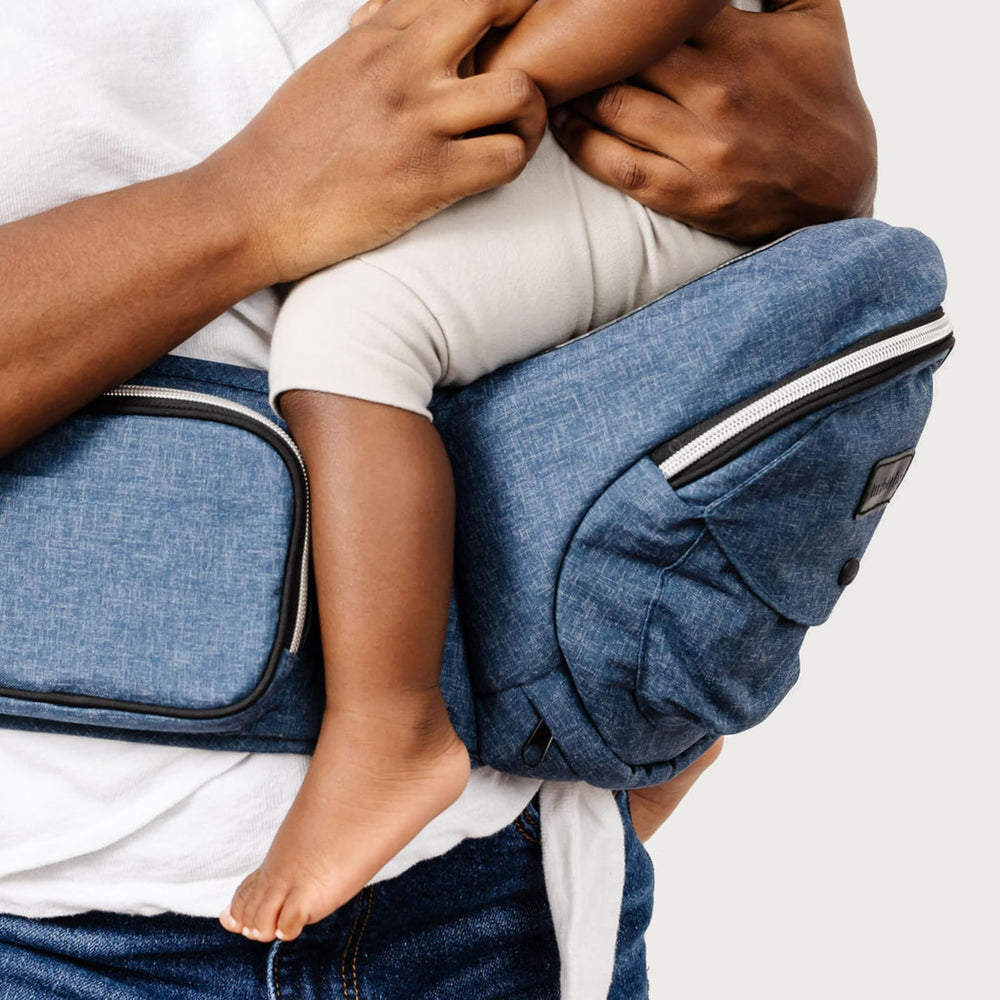 TushBaby side carry and feeding position for hip comfort on the go.