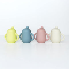 TushBaby Training Cup fits in a diaper bag or car cup holder for on-the-go hydration.