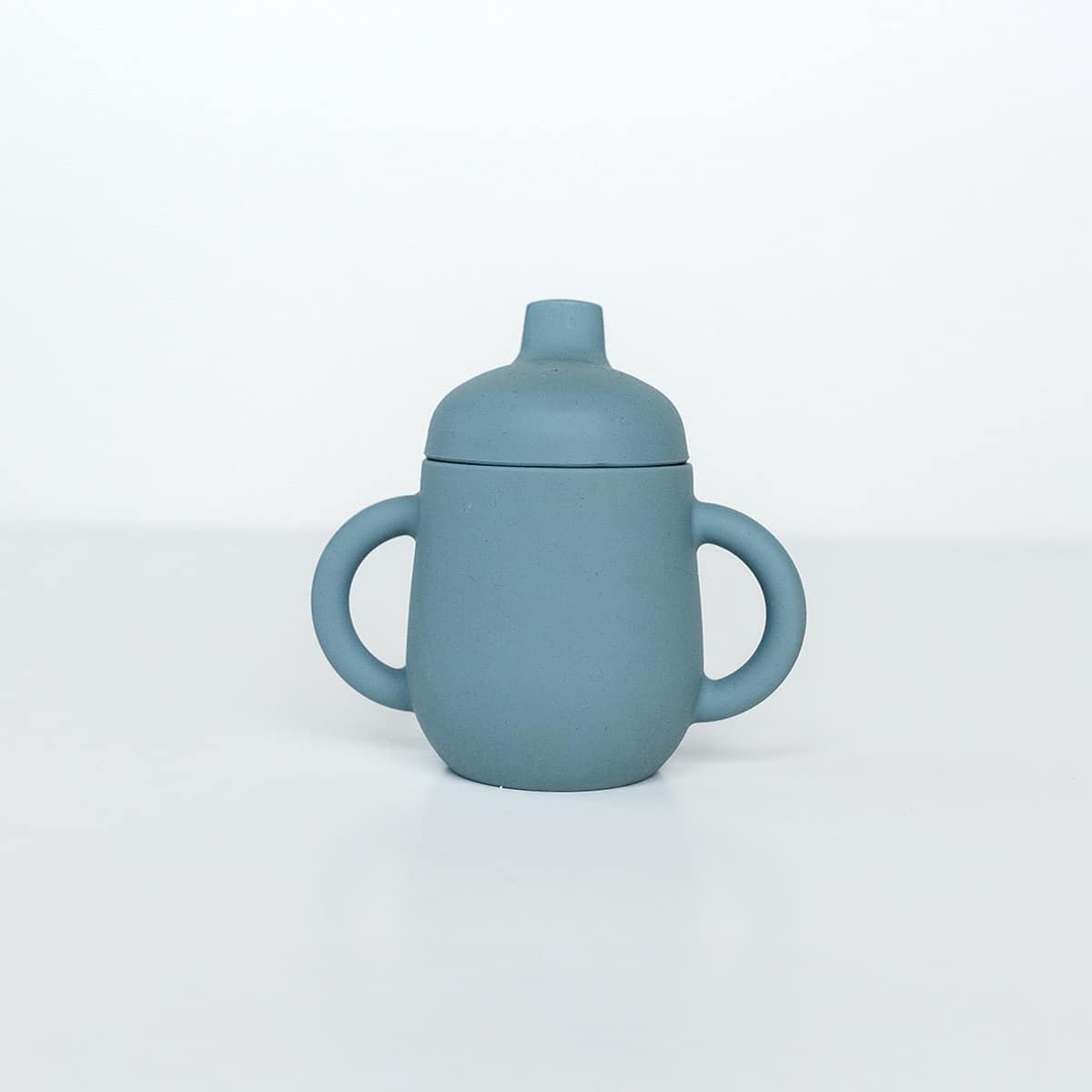 TushBaby Training Cup with soft spout supports gentle sipping and reduced spills.