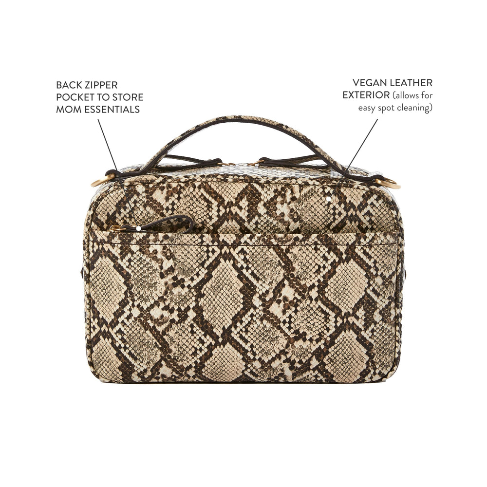 TWELVElittle Luxe Diaper Clutch detachable mesh pouch stores creams for quick access.