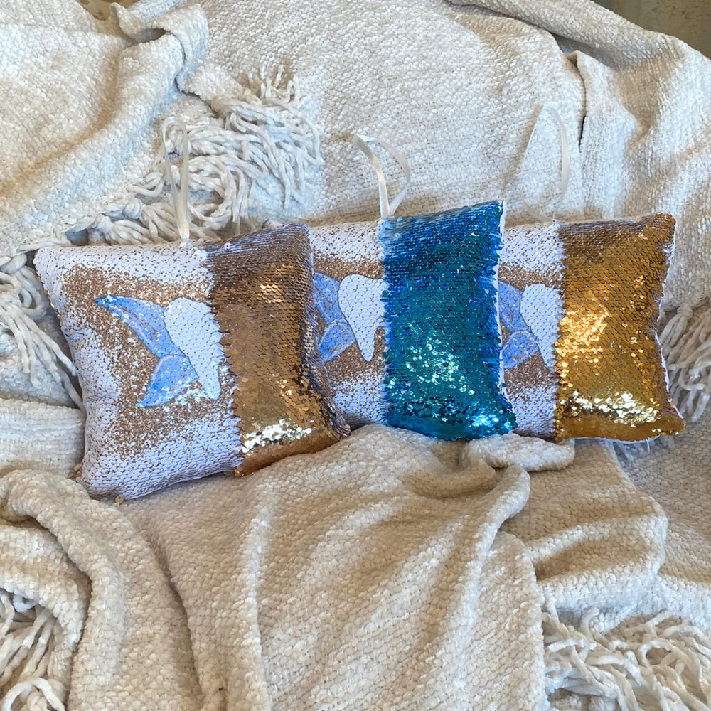 Twenty Moments of Tooth pillow loop for easy hanging beside the bed.
