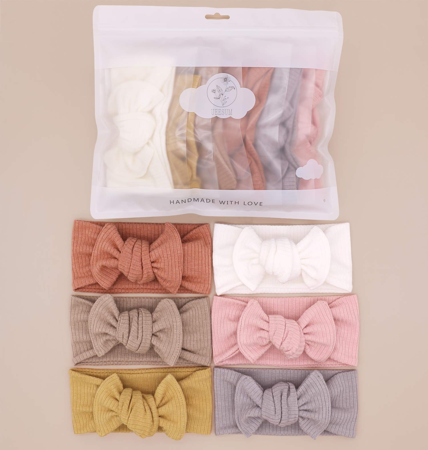 UeeSum mustard headband bow complements outfits and keeps baby comfortable outdoors