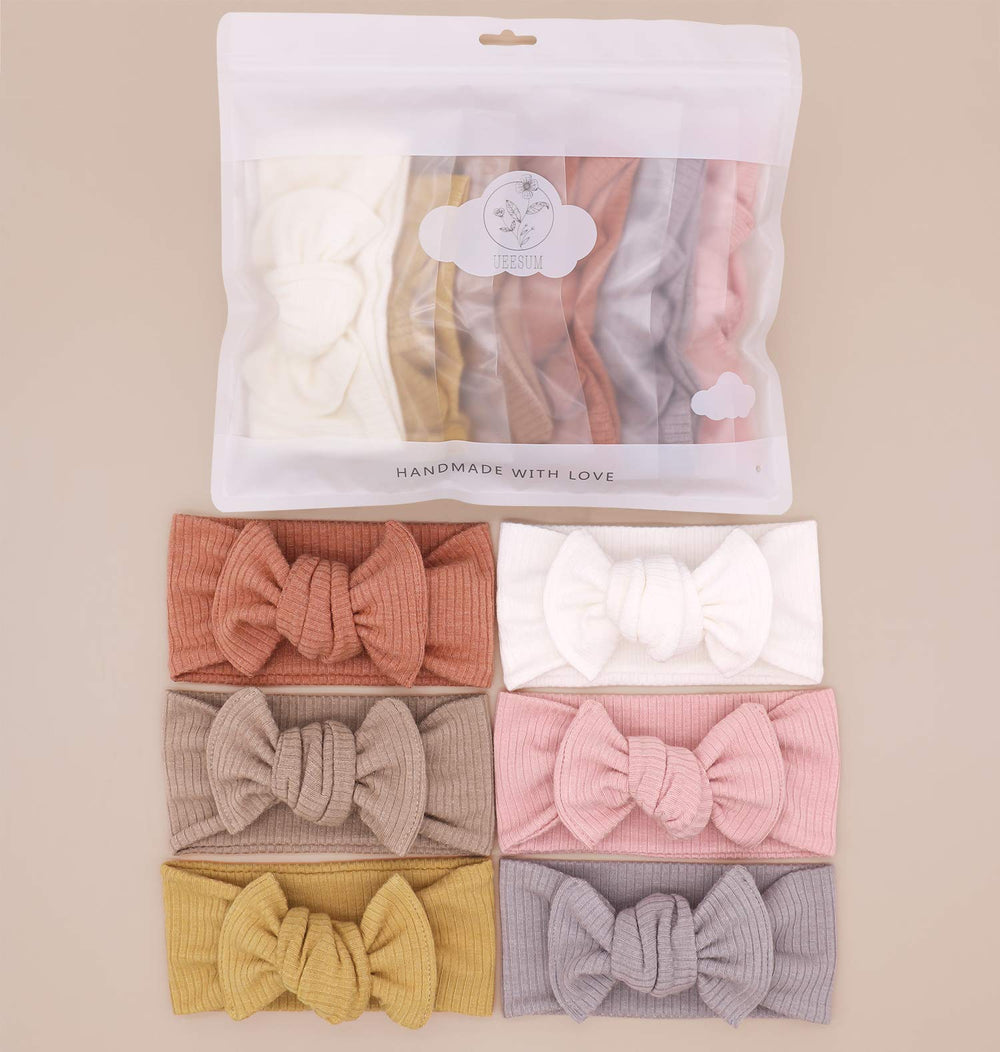 UeeSum mustard headband bow complements outfits and keeps baby comfortable outdoors