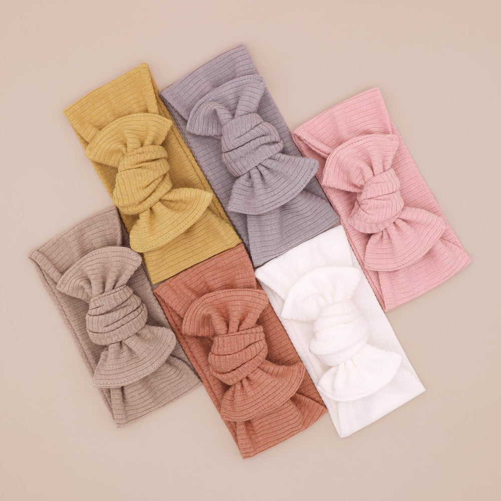 UeeSum white headband bow ideal for newborn photos and breathable wear