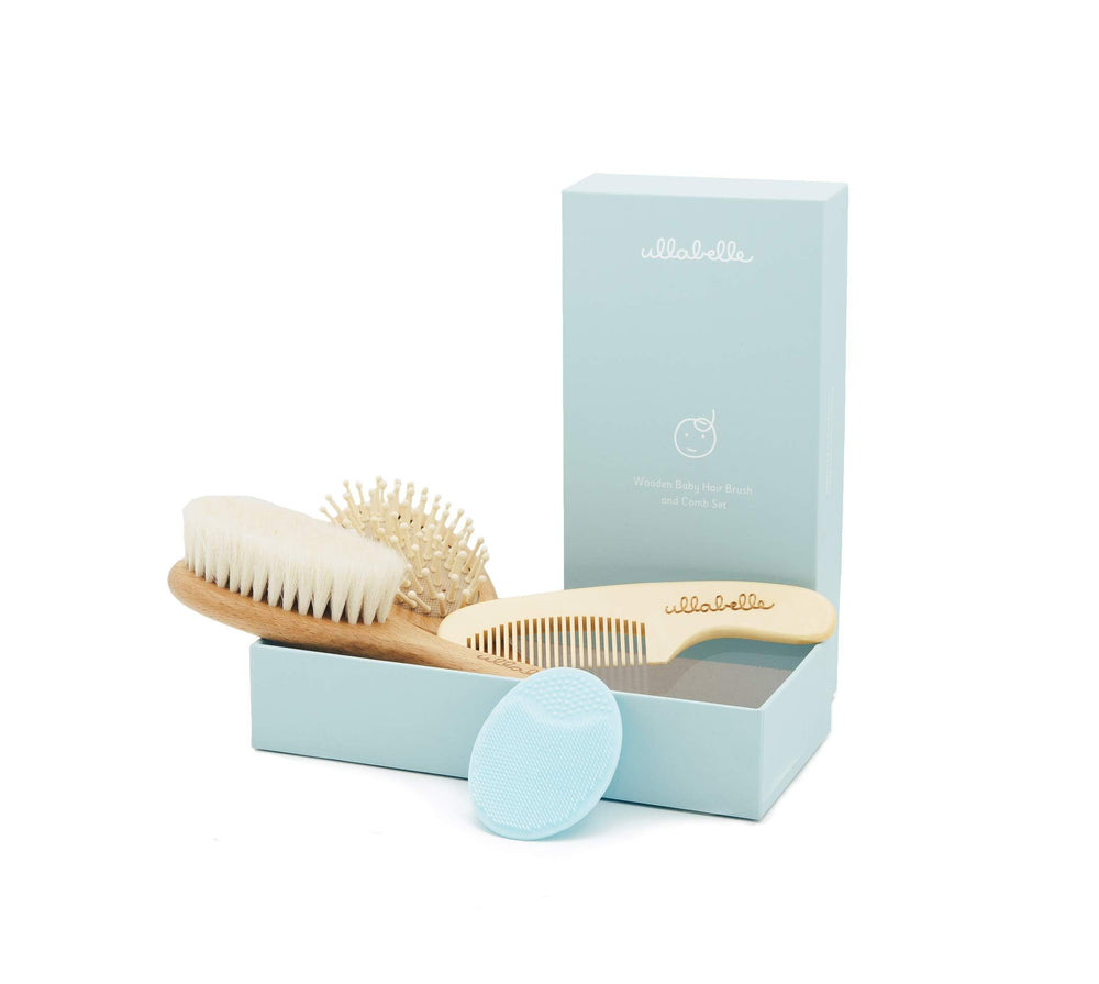 Ullabelle 4-piece wooden baby hair brush set in blue with goat hair bristles for gentle scalp care.