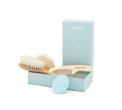 Ullabelle 4-piece wooden baby hair brush set in blue with goat hair bristles for gentle scalp care.