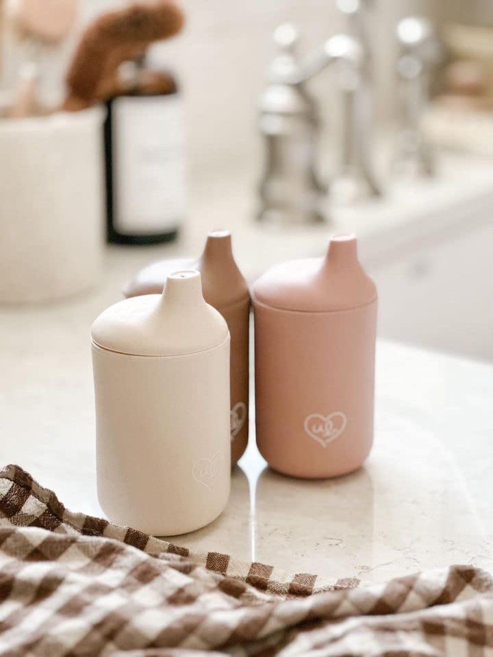 Ullabelle cups feature ergonomic grip aiding tiny hands to hold.