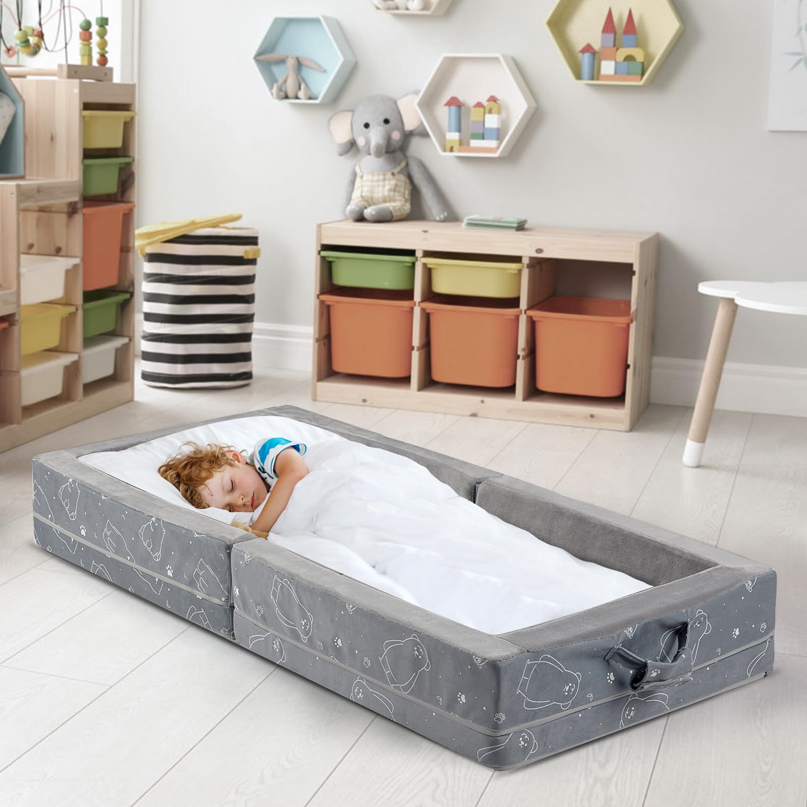 Umoving grey bed with safety rails ideal for hotel or home use.