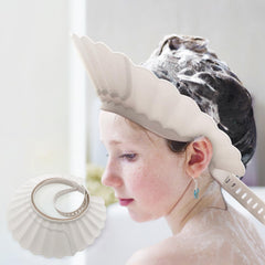 UMUACCAN baby shower cap shield worn during bath protects eyes and prevents splashes.