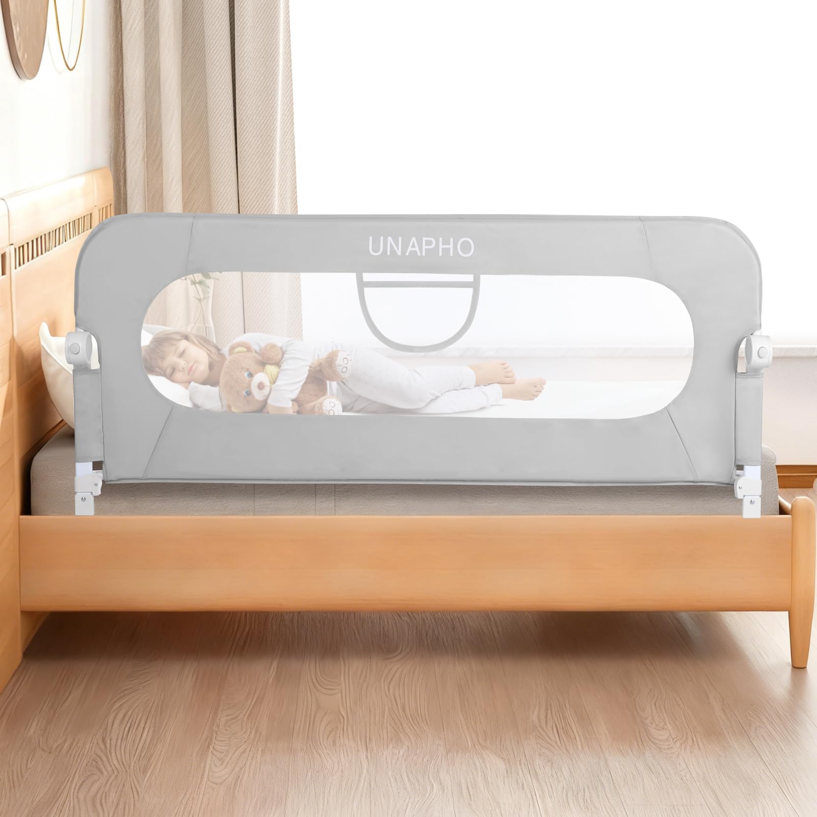 UNAPHO bed rail swings down for easy toddler access during bedtime