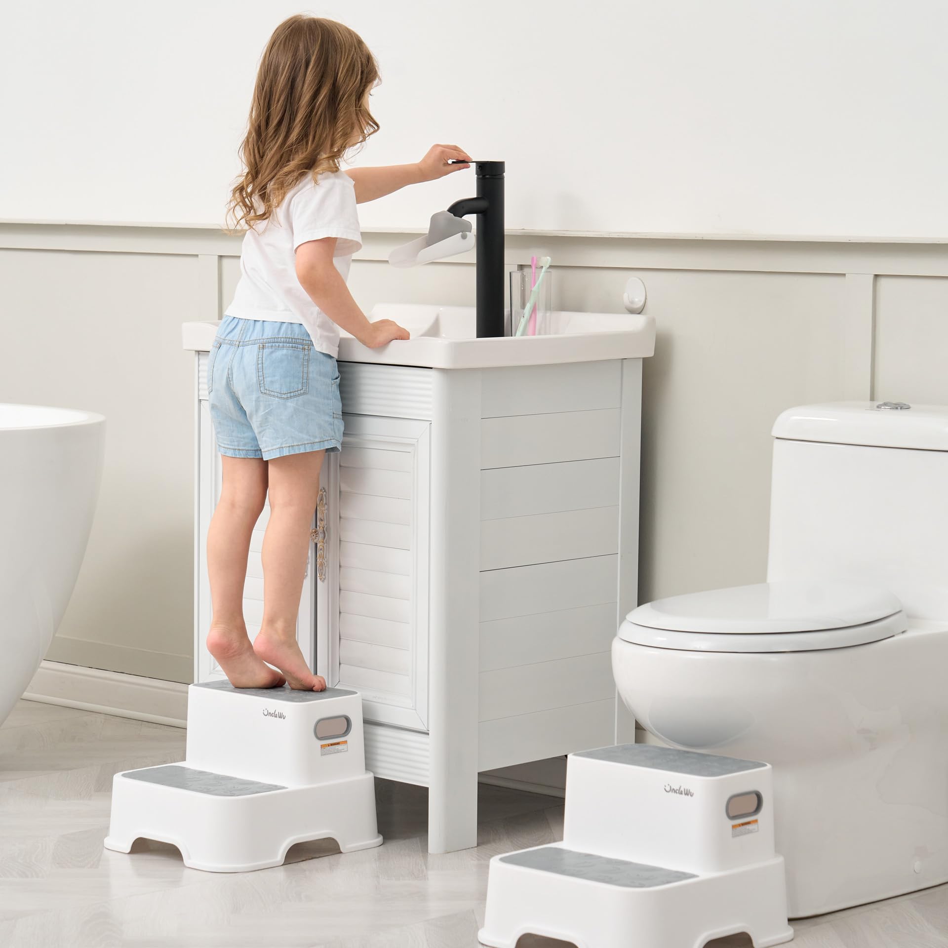 UNCLE WU toddler step stool grey side view highlights compact footprint for small spaces.