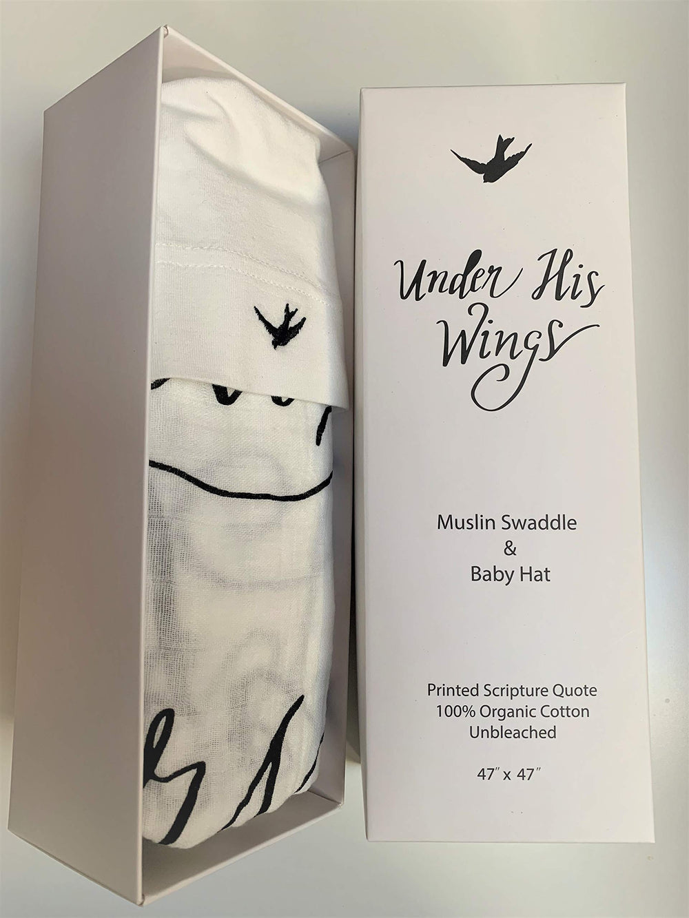 Under His Wings swaddle on a sleeping baby shows secure, calm rest potential