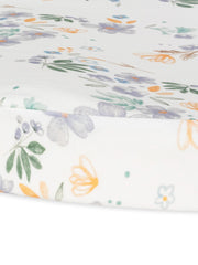 Under The Nile bassinet sheet Daisy closeup highlighting soft organic cotton for breathable nursery comfort.