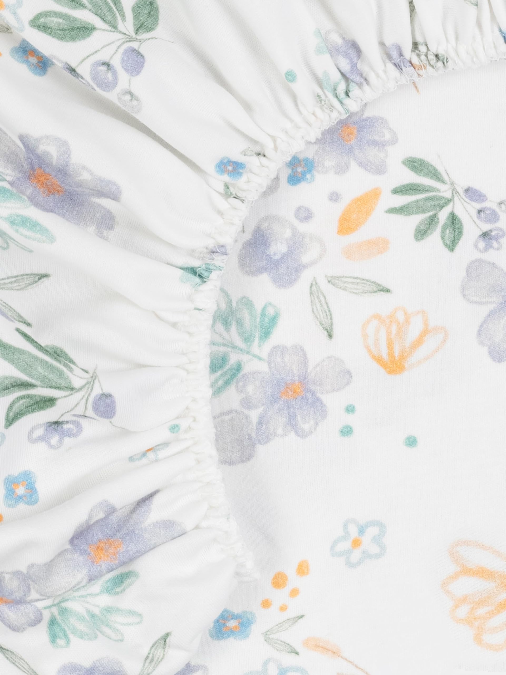 Under The Nile bassinet sheet Daisy in nursery scene promotes safe, natural sleep with breathable fabric.