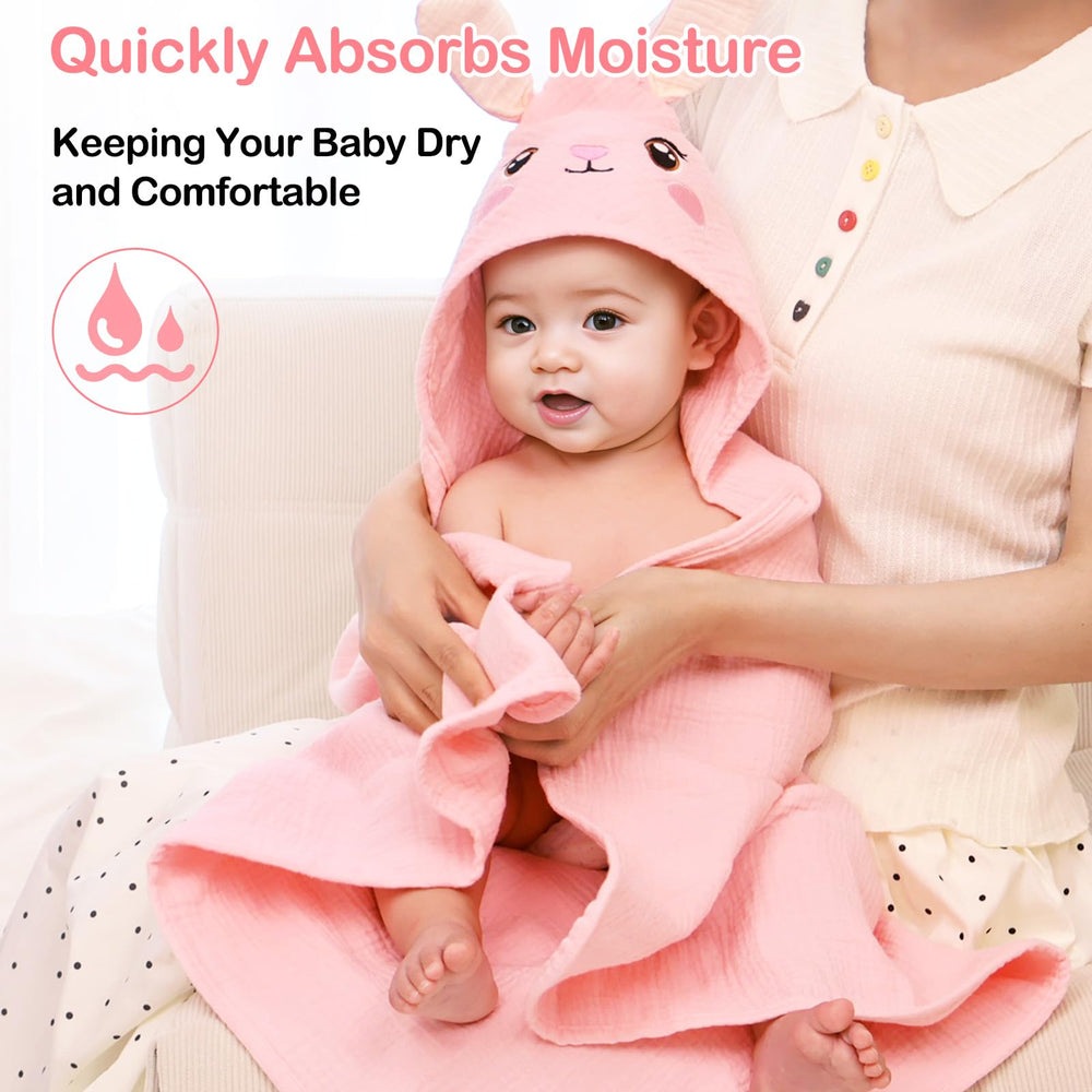 Baby wrapped in Unicorn Castle hooded towel for a calm bath-time snuggle