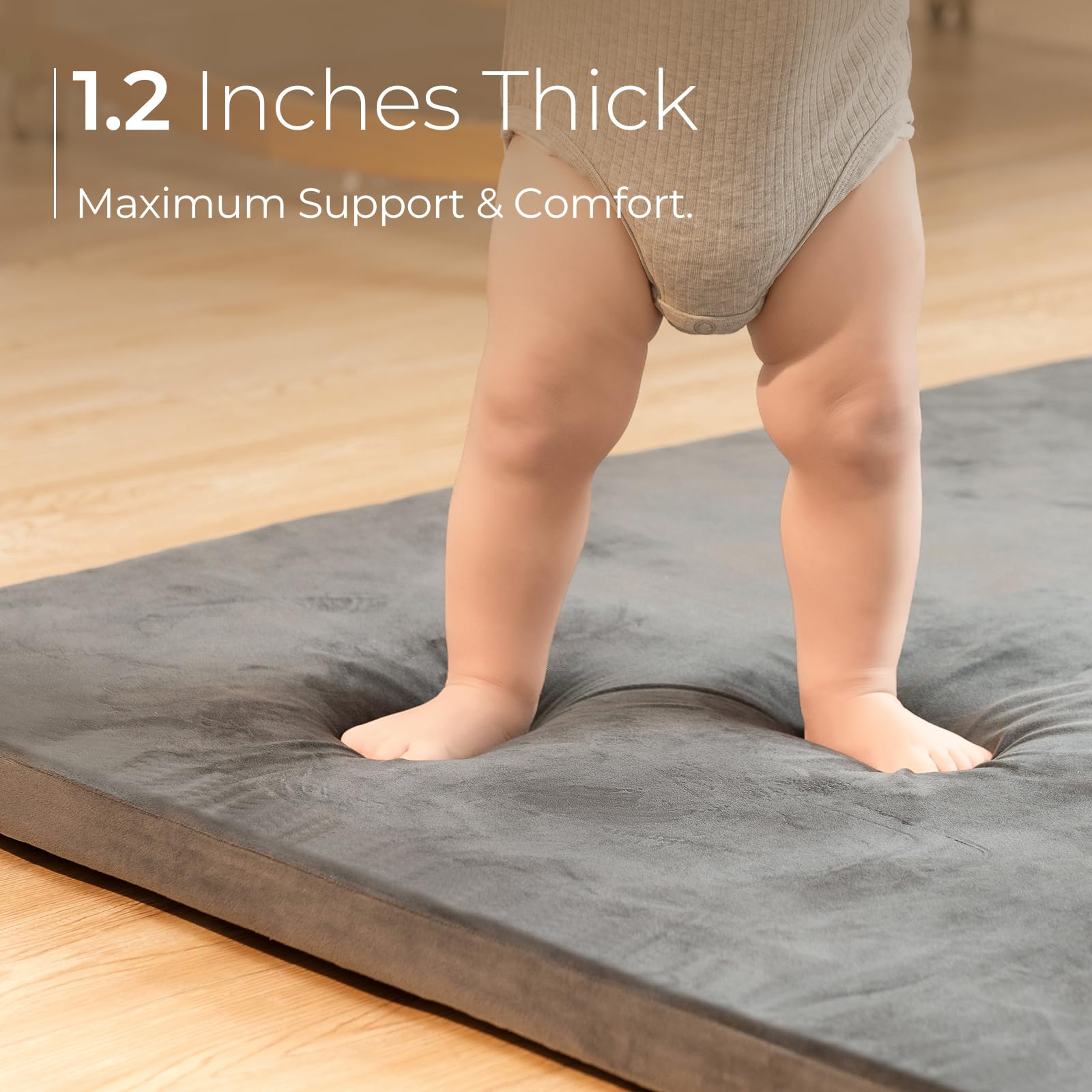 Uniency baby play mat removable cover shown being machine washed for easy cleaning.