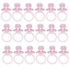 Unique pink acrylic crystal pacifier favor close-up, showcasing table decor sparkle and playful baby-shower charm.