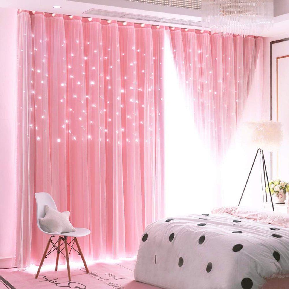 UNISTAR stars blackout curtains pink panel close-up reveals star cutouts for dreamy privacy.