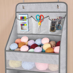 Univivi over-door organizer in use with baby items for easy access.