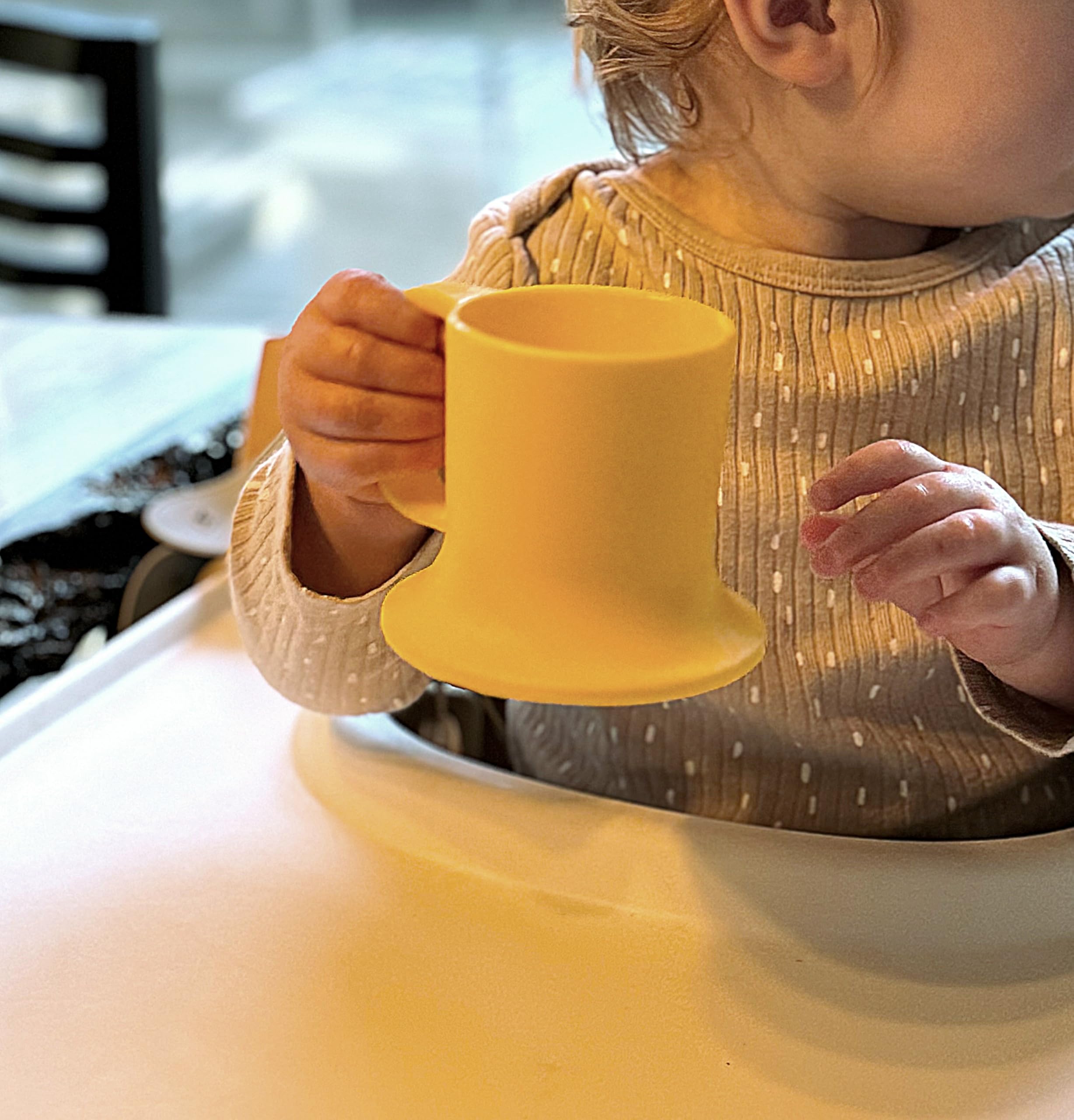 Untippy sun-colored silicone mug suitable as smoothie cup or training cup.