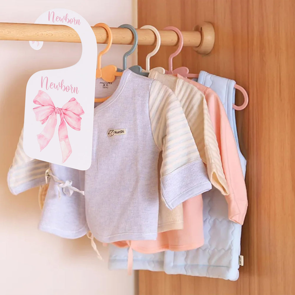Bow-style nursery divider helps busy parents categorize clothes efficiently.