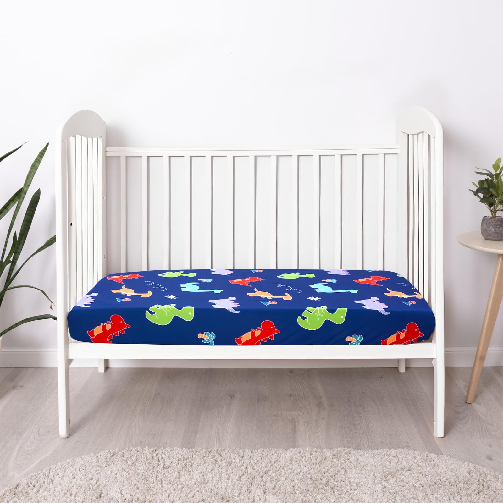 UOMNY crib sheet with dinosaur pattern adds playful nursery decor