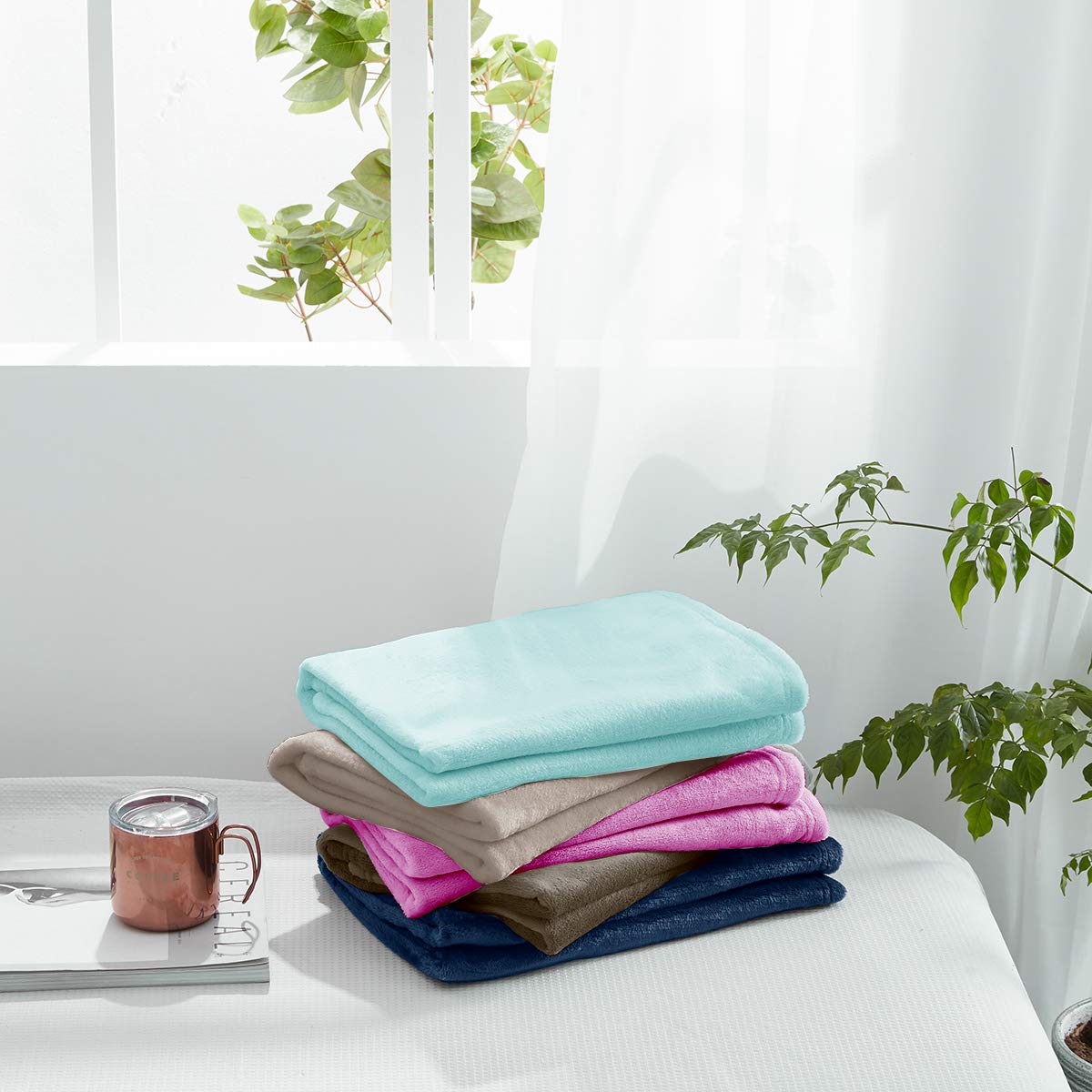 UOZZI Bedding blanket in crib, purple, soft layer for restful naps.
