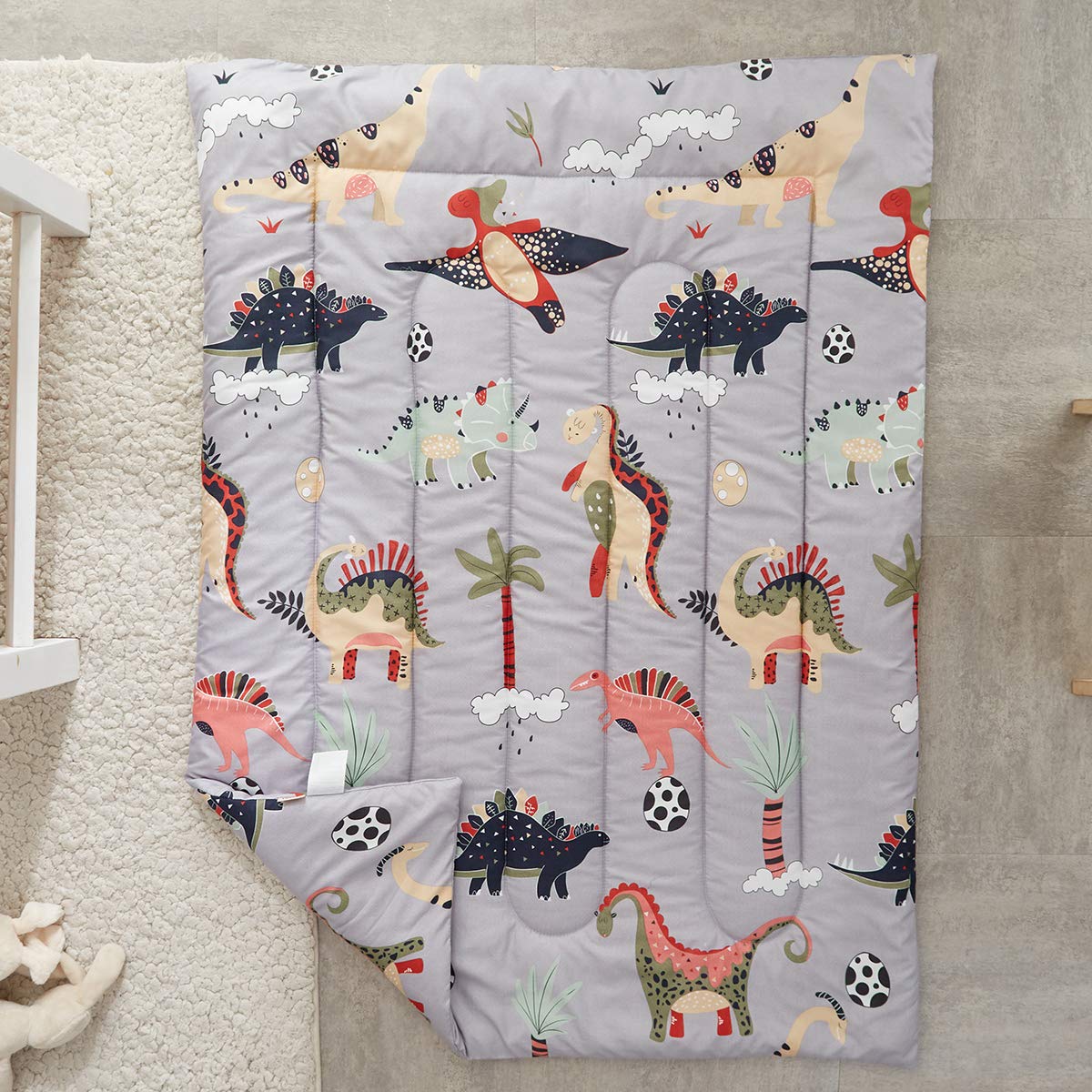 UOZZI BEDDING colorful dinos design adds playful mood to bedtime routine.