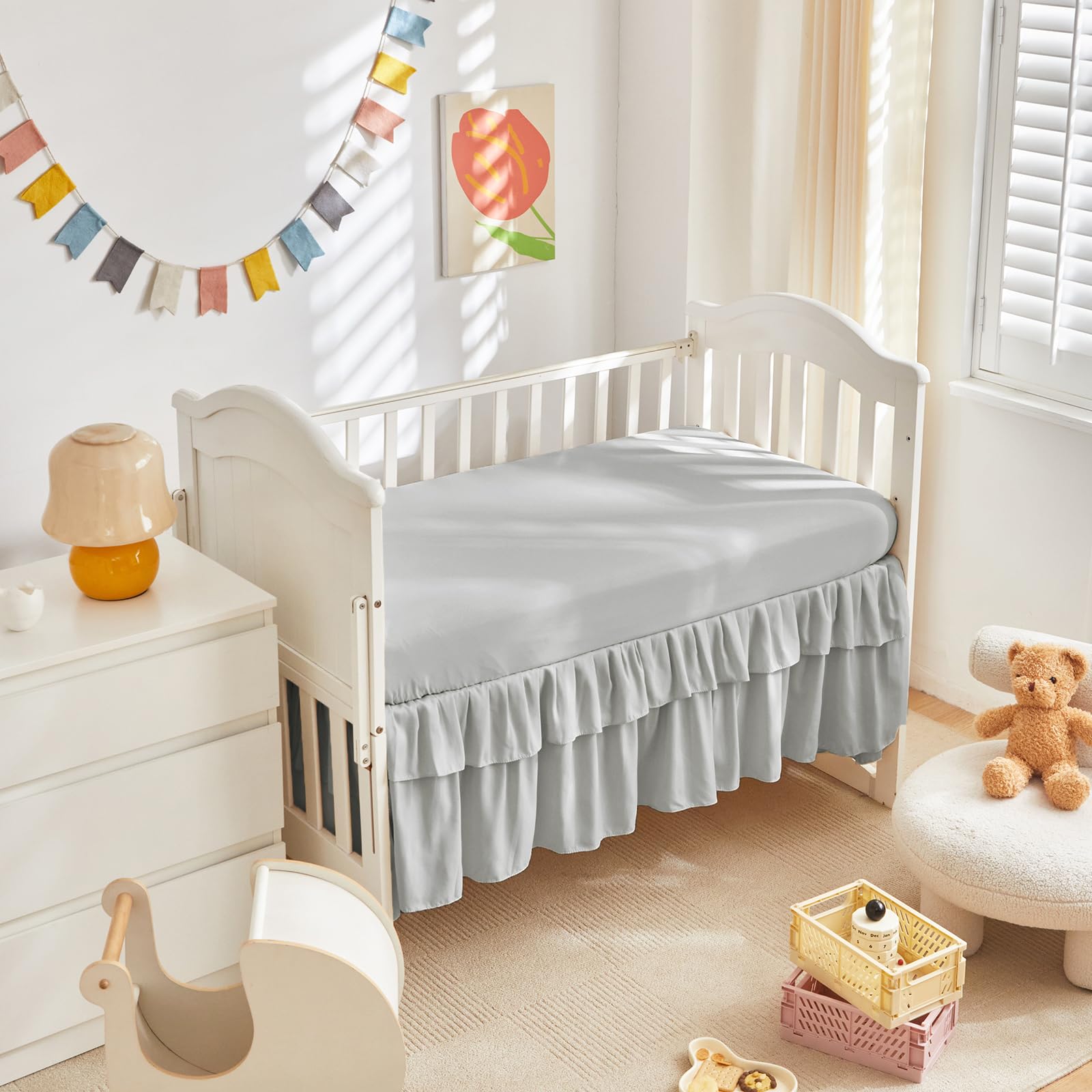 UOZZI BEDDING crib bed skirt detail adds tidy decorative finish to nursery.
