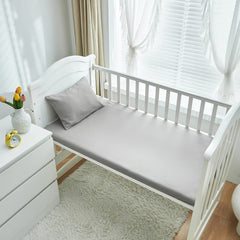 UOZZI BEDDING fitted crib sheet 28x52 showcasing secure fit