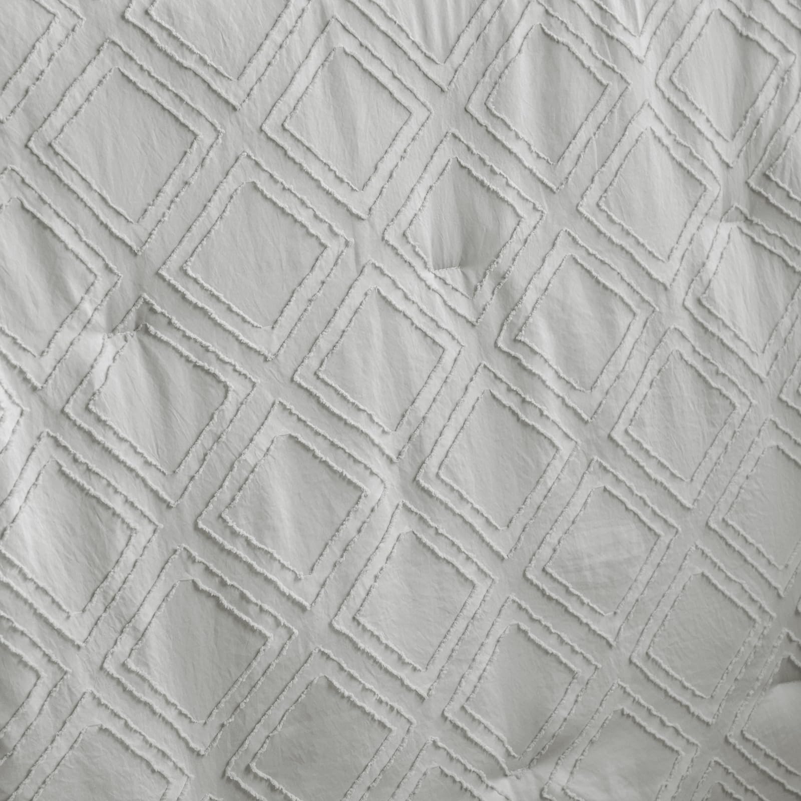 UOZZI BEDDING crib sheet closeup demonstrates secure fit for standard crib mattresses.