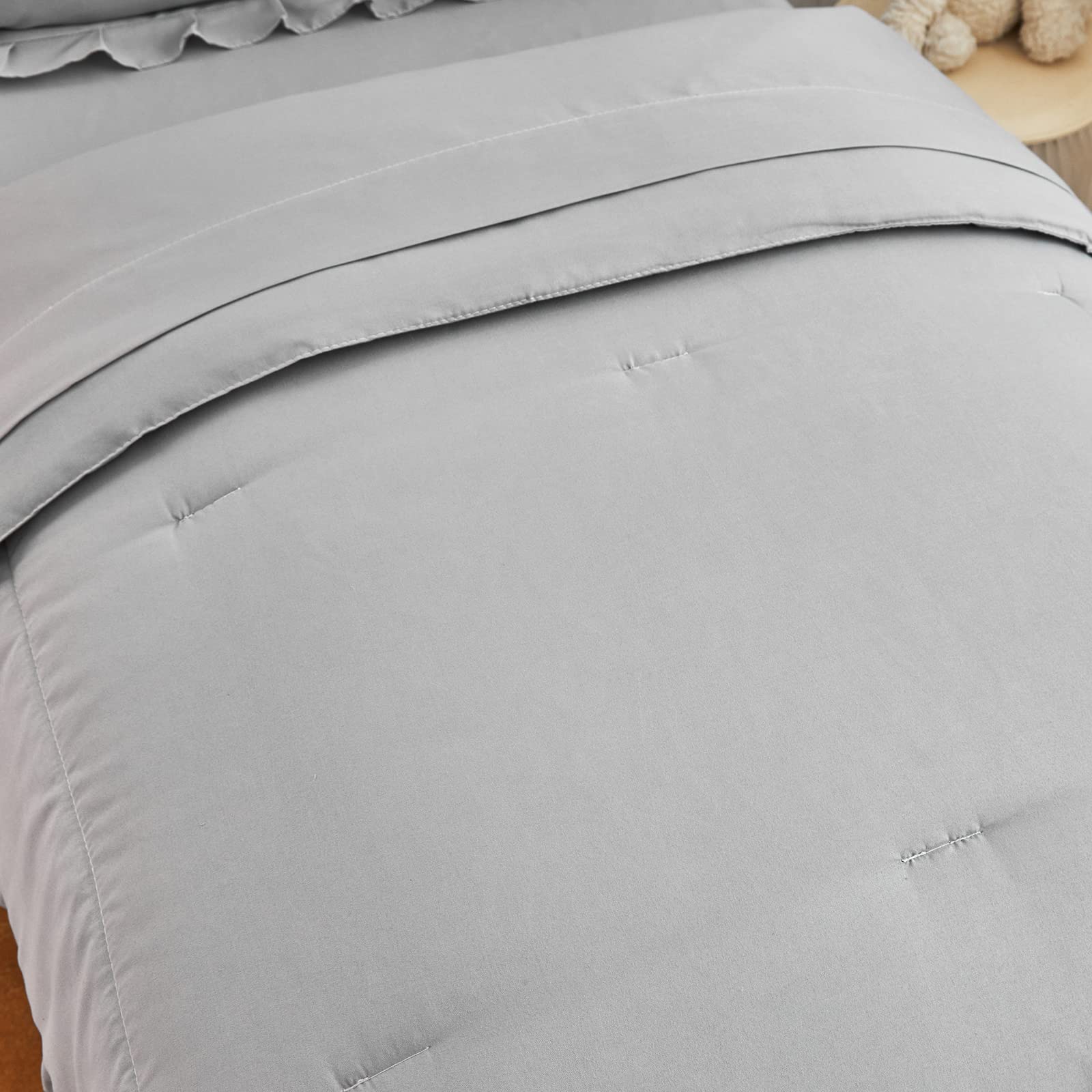 UOZZI Bedding gray on-bed view demonstrates full coverage.