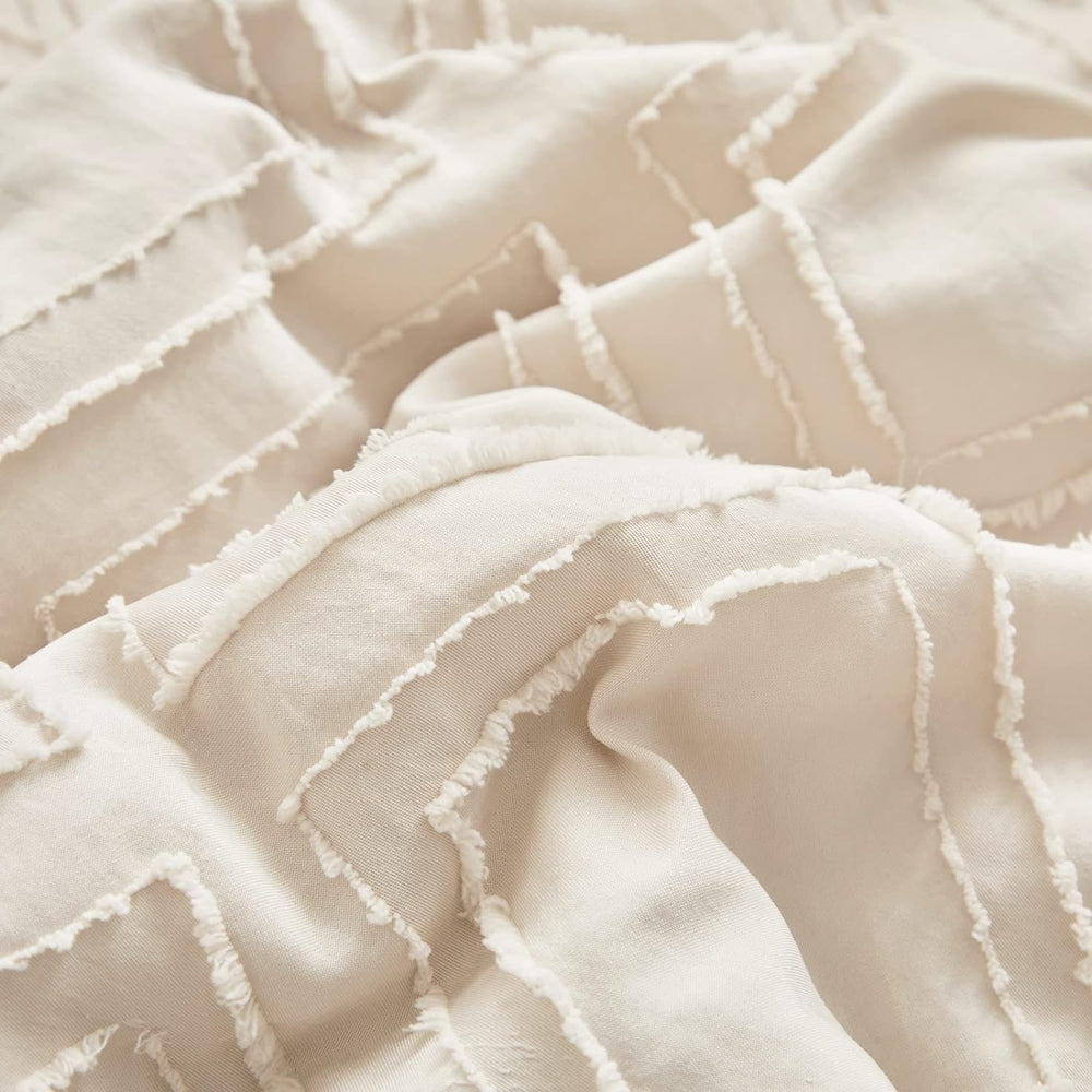 UOZZI BEDDING mini crib boho chic design showcases tufted embroidery.