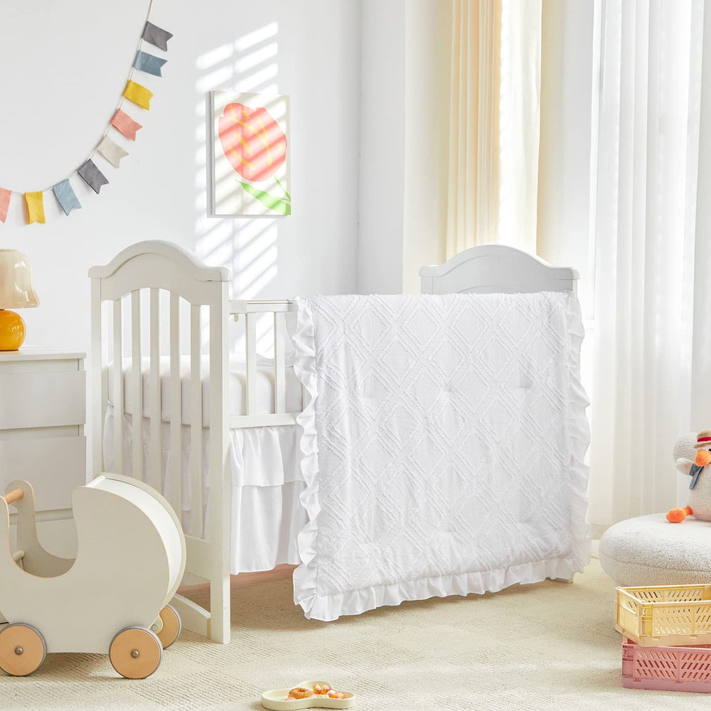 UOZZI BEDDING mini crib comforter with ruffle creates cozy naps for baby